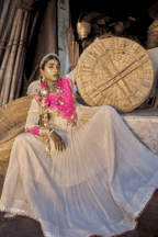 Woman in traditional attire with a large woven basket in an outdoor setting