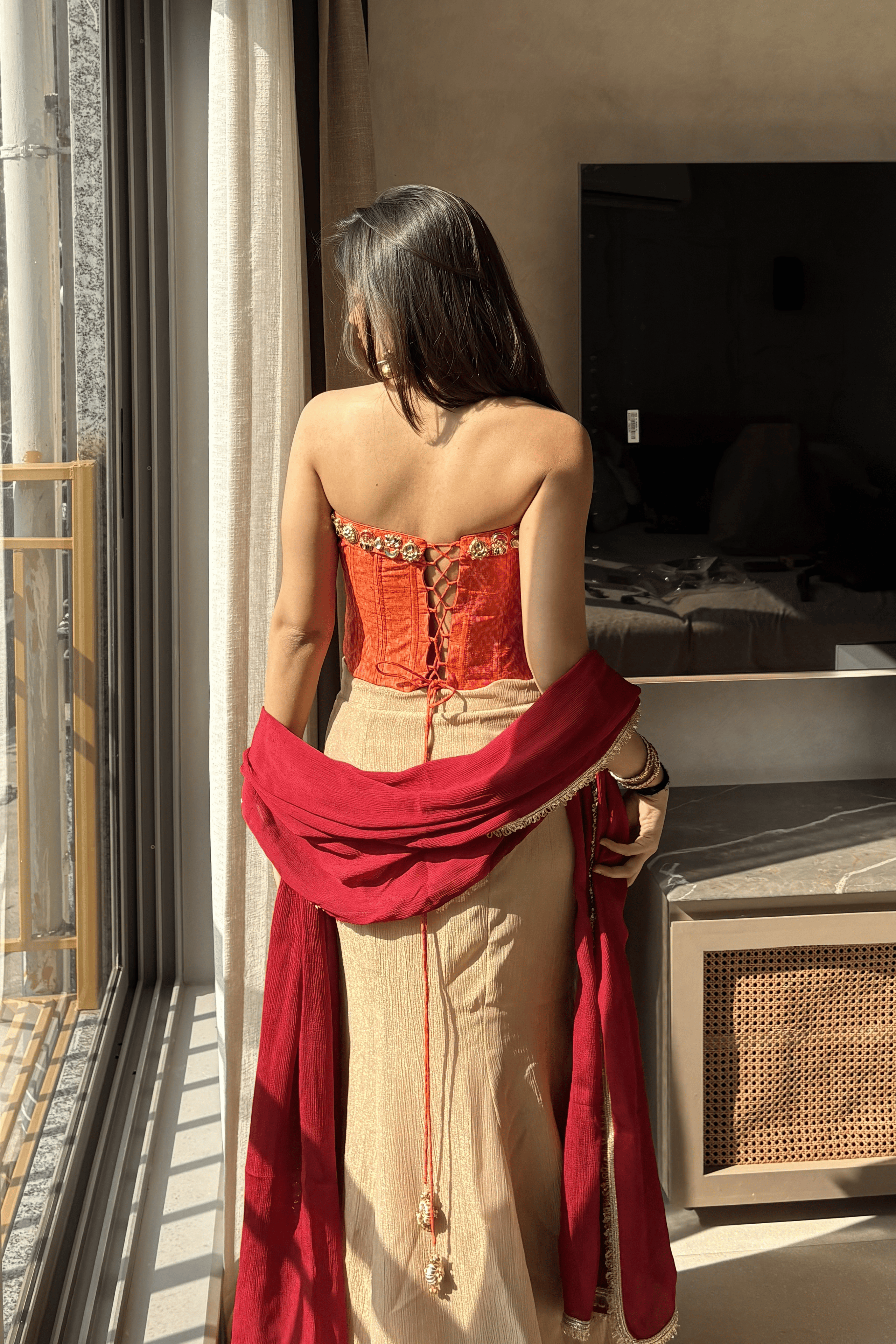 Ruhani - Orange Ikat Corset with Rose Gold Fishcut Lehenga and Kundan Work